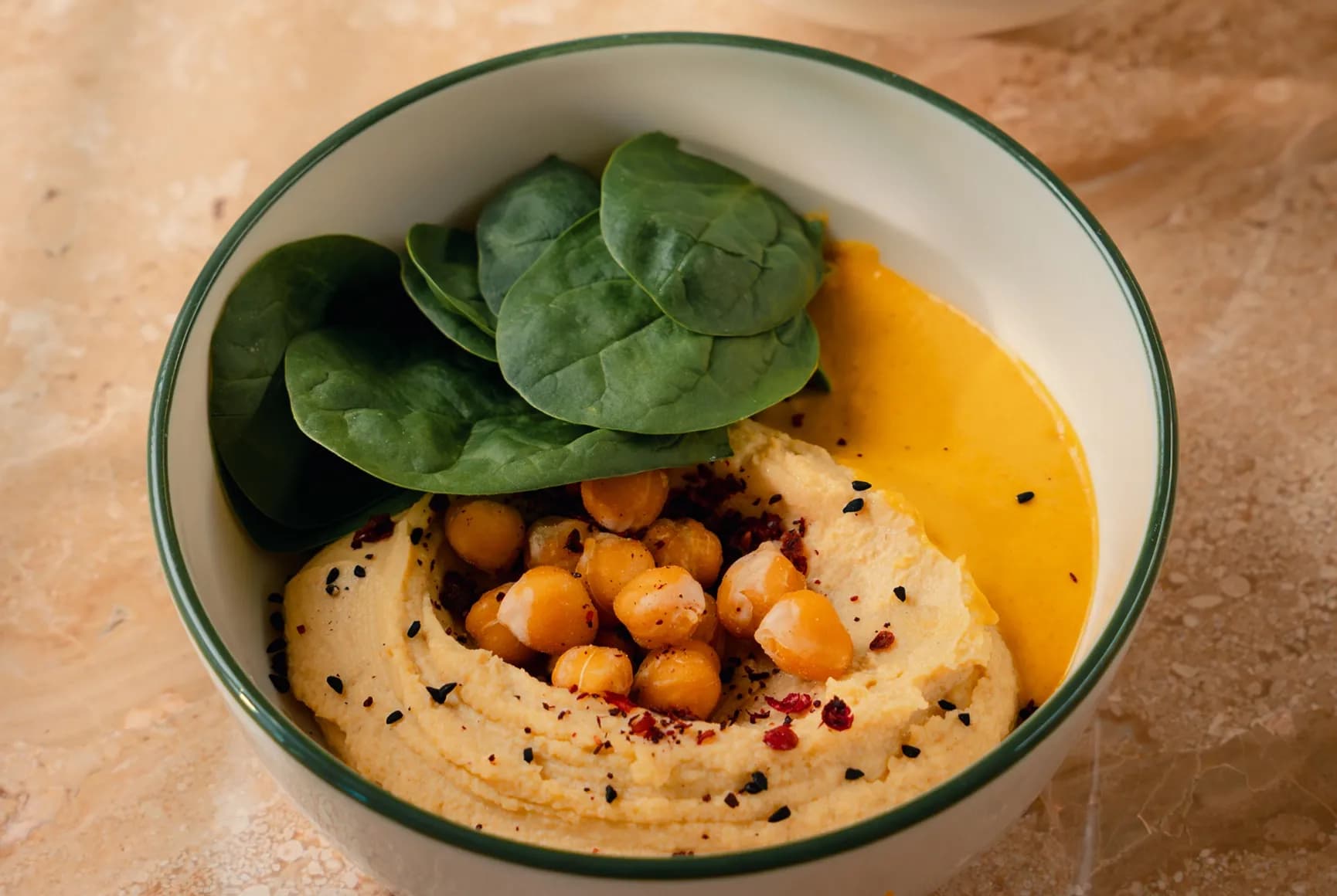Hummus with Tahini sauce and breadsticks.